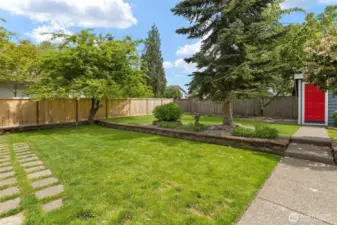 Level lot offers perfect play and garden space.