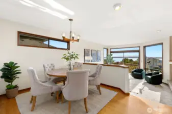 Formal dining & living facing Western Sound & Mountain Views, opening to deck