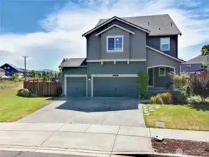 Welcome home to mountain views! Perched perfectly at the end of a quiet street, this stunning Craftsman not only offers incredible curb appeal but also peekaboo views of Mt. Rainier right from your driveway.