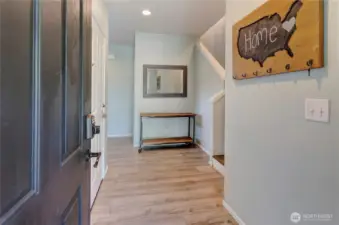 Step inside and feel right at home—this welcoming entryway features updated flooring, warm accents, and a layout that instantly invites you in.