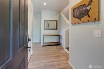 Step inside and feel right at home—this welcoming entryway features updated flooring, warm accents, and a layout that instantly invites you in.