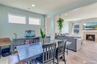 Bright and inviting open-concept living! The dining area flows seamlessly into the cozy living room with a modern fireplace—perfect for everyday living and entertaining.