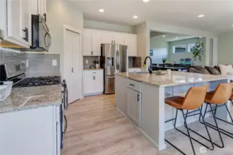Open, airy, and designed for connection—this kitchen flows effortlessly into the dining and living areas, making it the heart of the home for meals, gatherings, and everyday living.