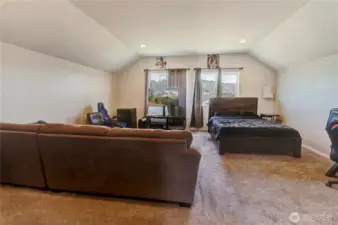 Tucked away on the third floor, this expansive bonus room doubles as a fifth bedroom or flex space—perfect for guests, gaming, a home office, or movie nights with a view!