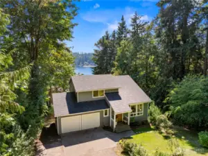 Sited on .57 acres which includes an adjacent .08 acre tax lot. Lush evergreen trees and mature hydrangeas grace the front yard. The lawn was seeded in the Spring and has grown in beautifully!