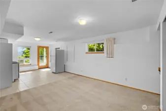 Down the stairs next to the main level kitchen leads us to the lower level area. Guest suite, multi-generational living - the choice is yours. This lower level has a separate entrance lending to the multi-functionality of the space.