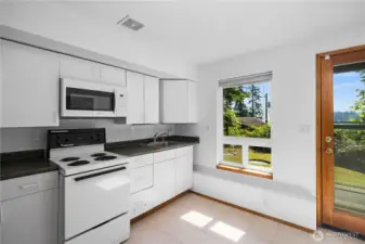 Kitchenette with ample storage.