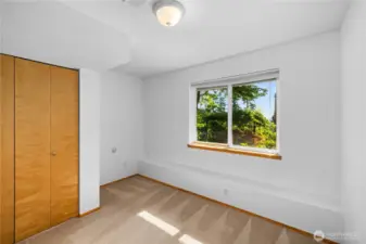 Lower level and third bedroom with closet and views of the lower level garden area.