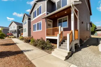 Stroll the landscaped path to your covered front porch.