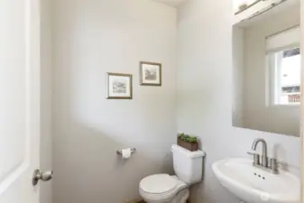 Stylish half bath with simple, modern finishes.