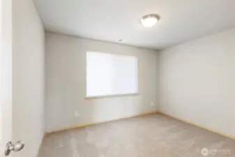 Flexible bedroom for guests, work, or hobbies.