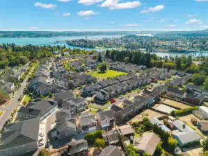 Bird’s-eye view of community close to water and amenities.