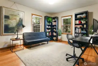The main floor office or bedroom.  The whole house has beautiful oak flooring.