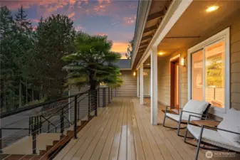 New lifetime deck surface with custom-made railings, providing a durable and inviting outdoor space to relax and take in the scenic surroundings.