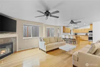 Main floor living room with open concept to the kitchen