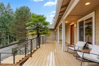 New lifetime deck surface with custom-made railings, providing a durable and inviting outdoor space to relax and take in the scenic surroundings.