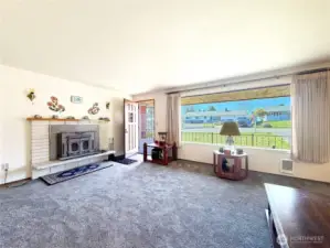 Large living room with large picture window.