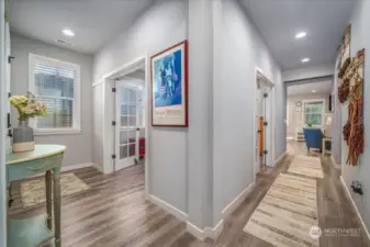 Entry on the left and hallway to the kitchen and living room on the right.