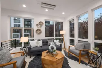 Bright, airy, and drenched in natural light—this living space is a true sanctuary for relaxation or entertaining.