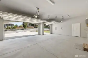 The 3 car garage has been fully finished, and even includes an extra niche for storage or work bench.