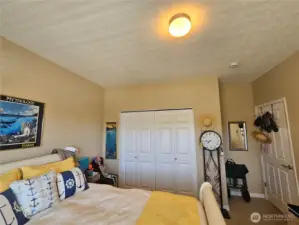 Spare large bedroom, with a large window for lots if light, and views.