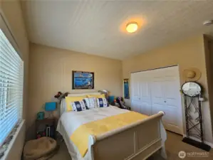 Spare bedroom off the entry with large closet.