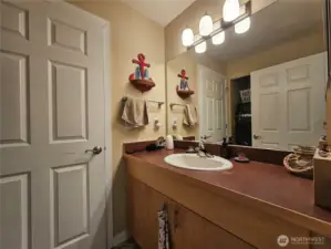 Guest bathroom right off the kitchen for easy access.