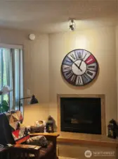 Tiled propane fireplace makes for a cozy reading spot.