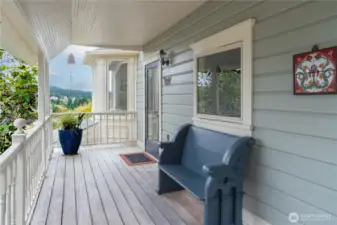 Covered front deck. Front door leads to two doors- one is the main level- 909. The other is upstairs- 913.