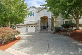 Inviting curb appeal including a semi-circular driveway greets you to this amazingly remastered home.