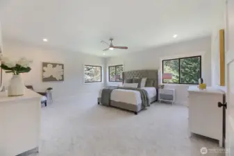 Your private getaway. This spacious luxurious Primary Suite is situated in the corner of the home, with extra windows bringing in natural daylight and overlooking the green space and golf course. All new lighting, ceiling fan, doors, millwork, fresh paint, and high-end carpeting & padding.