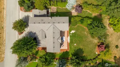 Your yard space is seen here, which goes beyond the tree line. Keep this privacy for yourself, or expand your yard and open up beyond!