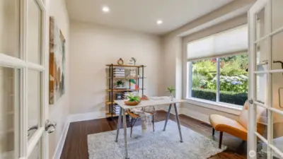 Enjoy this main floor office/flex space with glass pane french doors.