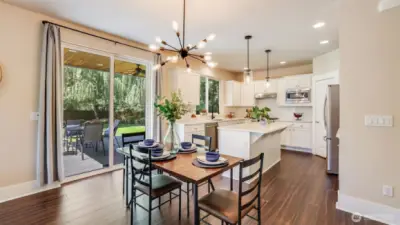 Enjoy this dining space just off the kitchen - great for quick meals or small gatherings!