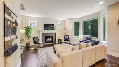 Enjoy cozy PNW weather in this spacious living room with gas fireplace - perfect place to watch the Seahawks this fall!