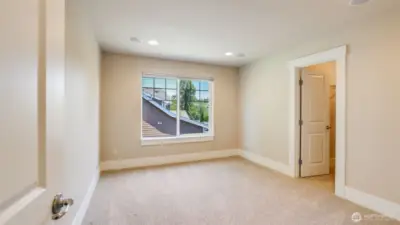 Upstairs guest bedroom #1 with walk-in closet!