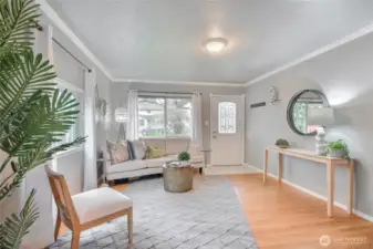 Step into the warm and inviting living room with real hardwoods.