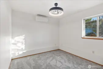Downstairs bedroom #3 with new carpet, mini-split and ceiling fan.