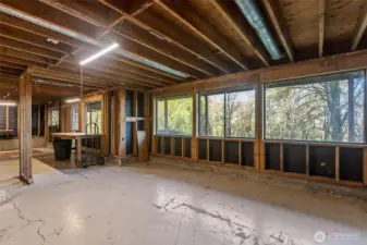 Large Unfinished Basement with large picture windows out to the yard.