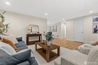 Designed for effortless entertaining, this spacious living area serves as the heart of the home, flowing seamlessly into the kitchen and rooms.