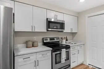 Sleek, sophisticated, and clutter-free. With floor-to-ceiling custom cabinetry, beautiful quartz countertops, and a minimalist aesthetic, this kitchen proves that high style and high function go hand-in-hand.