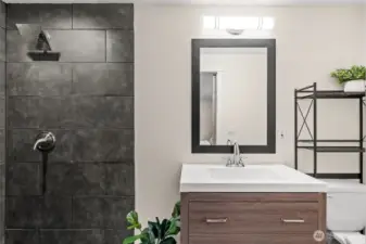Modern and efficient, this en-suite bathroom ties together natural elements with contemporary design.
