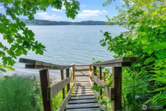 Your private path to paradise. These custom-built stairs offer seamless, direct access to the shoreline, turning the beach into your own personal backyard.