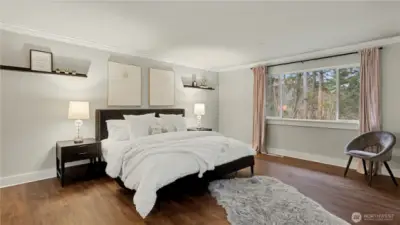 This light-filled primary retreat provides the perfect place to recharge and unwind.