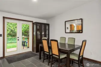 Large dining room over looks back deck