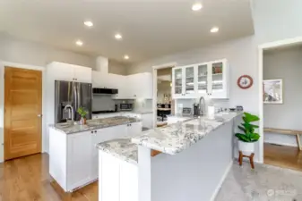 Breakfast bar, stainless steel appliances and custom cabinetry.