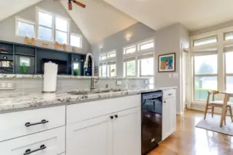 Granite countertops, white cabinets and real hardood floors