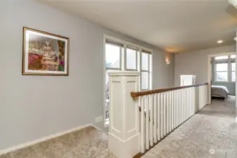 Wood spindles with lots of natural light from the windows.