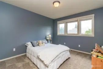 3rd bedroom with white millwork.