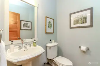 Powder room with pedistal sink and solid core doors